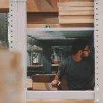 men organizing storage unit